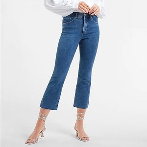 Express size 6 high rise cropped flare jeans with raw hem.